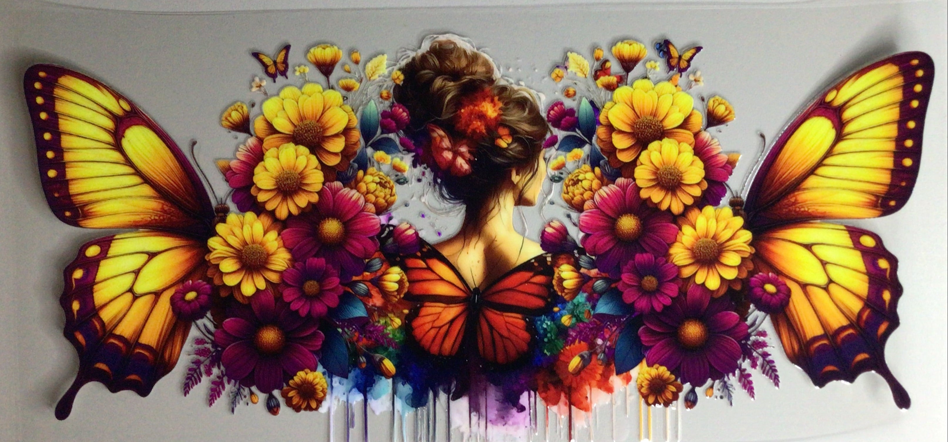 Colorful artwork of a woman surrounded by butterflies and flowers on a white background