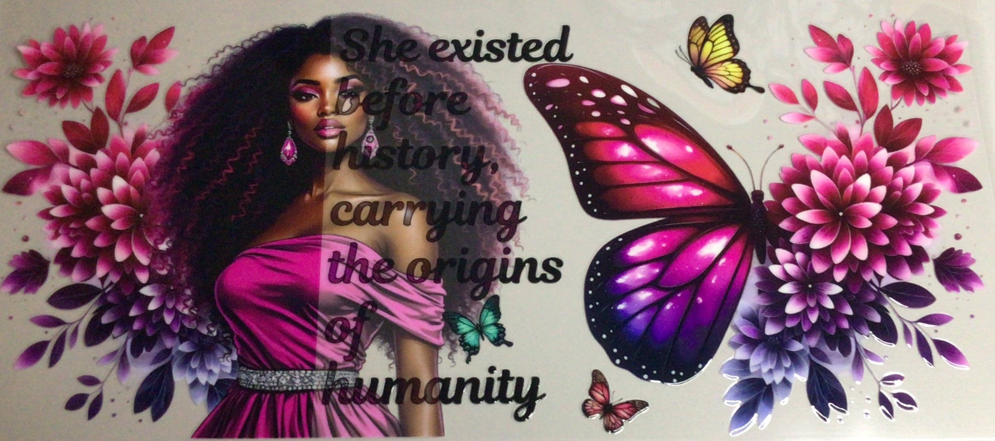 Decorative wall art with a woman's face, butterflies, and flowers on a plain background