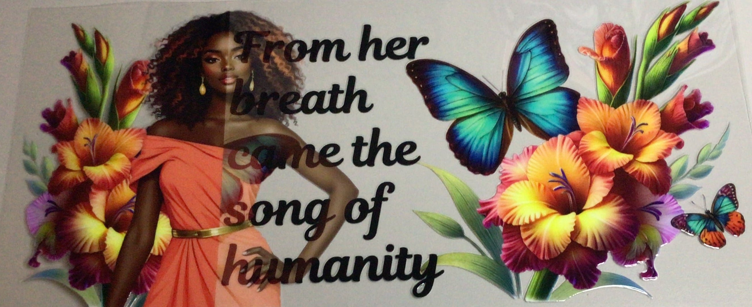 Decorative wall decal with flowers, butterfly, and text on a plain wall.